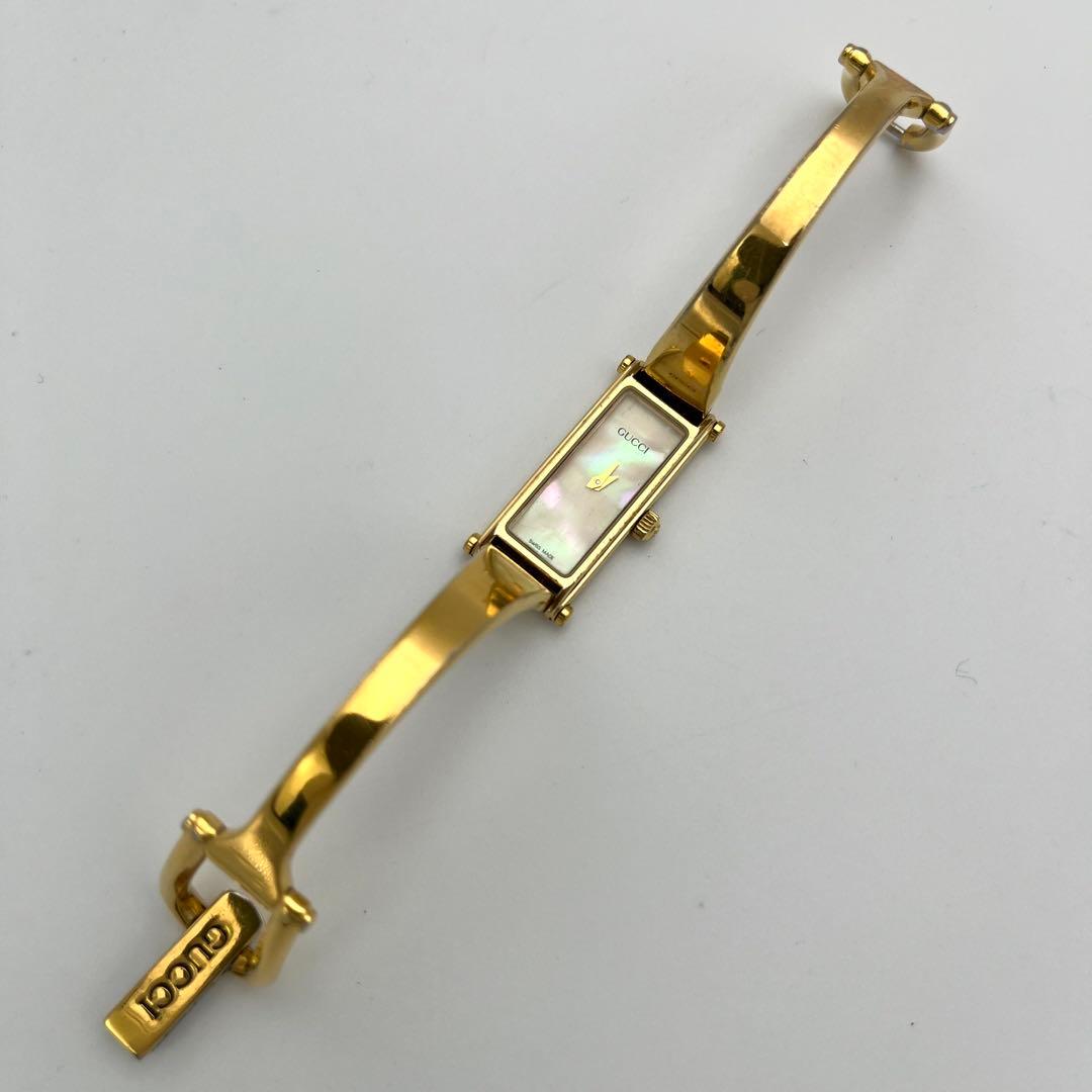 稼動 GUCCI シェル文字盤 1500L バングル ゴールド QZ 腕時計