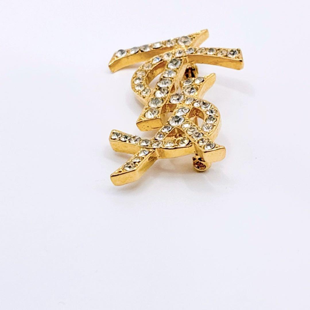 美品✨イヴサンローラン ブローチ カサンドラ ロゴ YSL ゴールド 人気