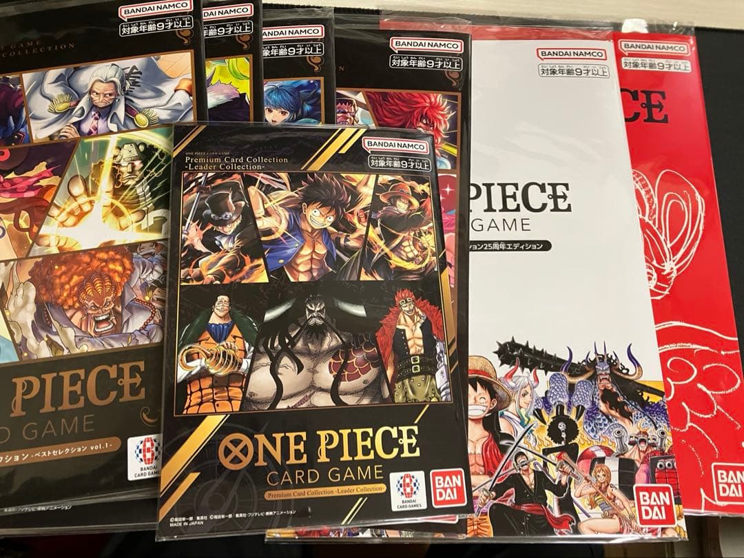 ワンピースカード　プレミアムコレクション等7冊未開封プロモ付25周年REDリーダ