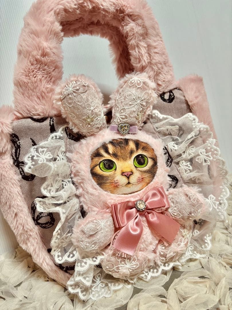 お取り置きです。コヤンイサムチョン　ピンクファのリボンゴブランころりんバッグ