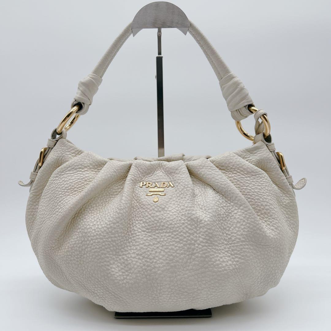 PRADA ワンハンドバッグ レザー ホワイト メタルロゴ ハーフムーン